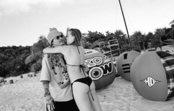 No_Reason_Jenz's tweet photo. So Amber Heard claims she was sexually assaulted during this time, yet here are pics from this trip of her practically throwing herself and pawing at Johnny....definitely not the actions of someone who is a sexual assault victim...
She's a liar and should be held accountable! https://t.co/8woEZuFzYV