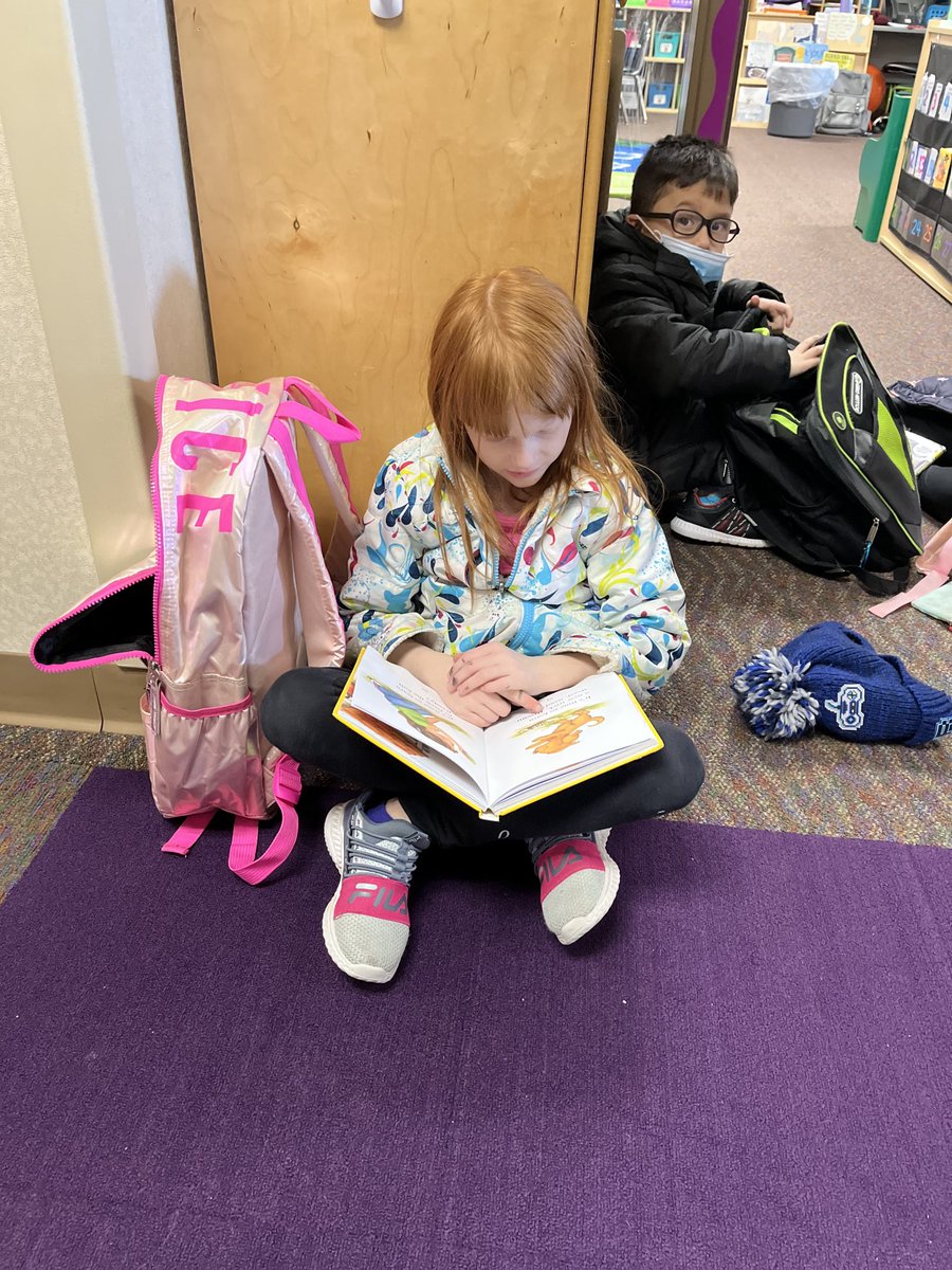 This student got a special new book from ⁦<a href="/MrsStepusin/">Mrs. Stepusin</a>⁩ and couldn’t put it down! #littlereader #wearewayne #welovebooks