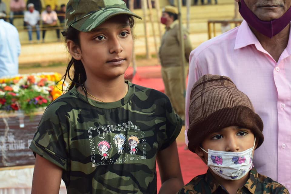 Havaldar Altaf Ahmed's son Mohammed Afrid and daughter Asma Jasmine paying tributes to their father wearing olive green dress during cremation in Virajpet earlier today. Altaf, who was on duty in Srinagar, was martyred after he was caught in a blizzard on February 23.