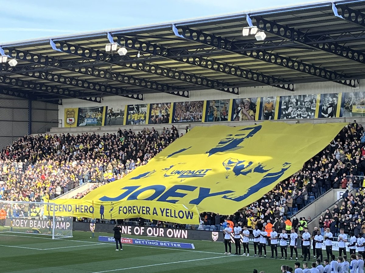 YellowArmyOUFC's tweet photo. 10,000 crowd, £10,000 raised and feels like 10,000 points!!

Everyone associated with Oxford United should feel very proud today! Joey's daughters will never forget how much we love their Dad 💛💙

The club, the staff, the fans, the family - you did Joey proud 👏💛

#Joey11 #OUFC https://t.co/H3PpaIkbJG
