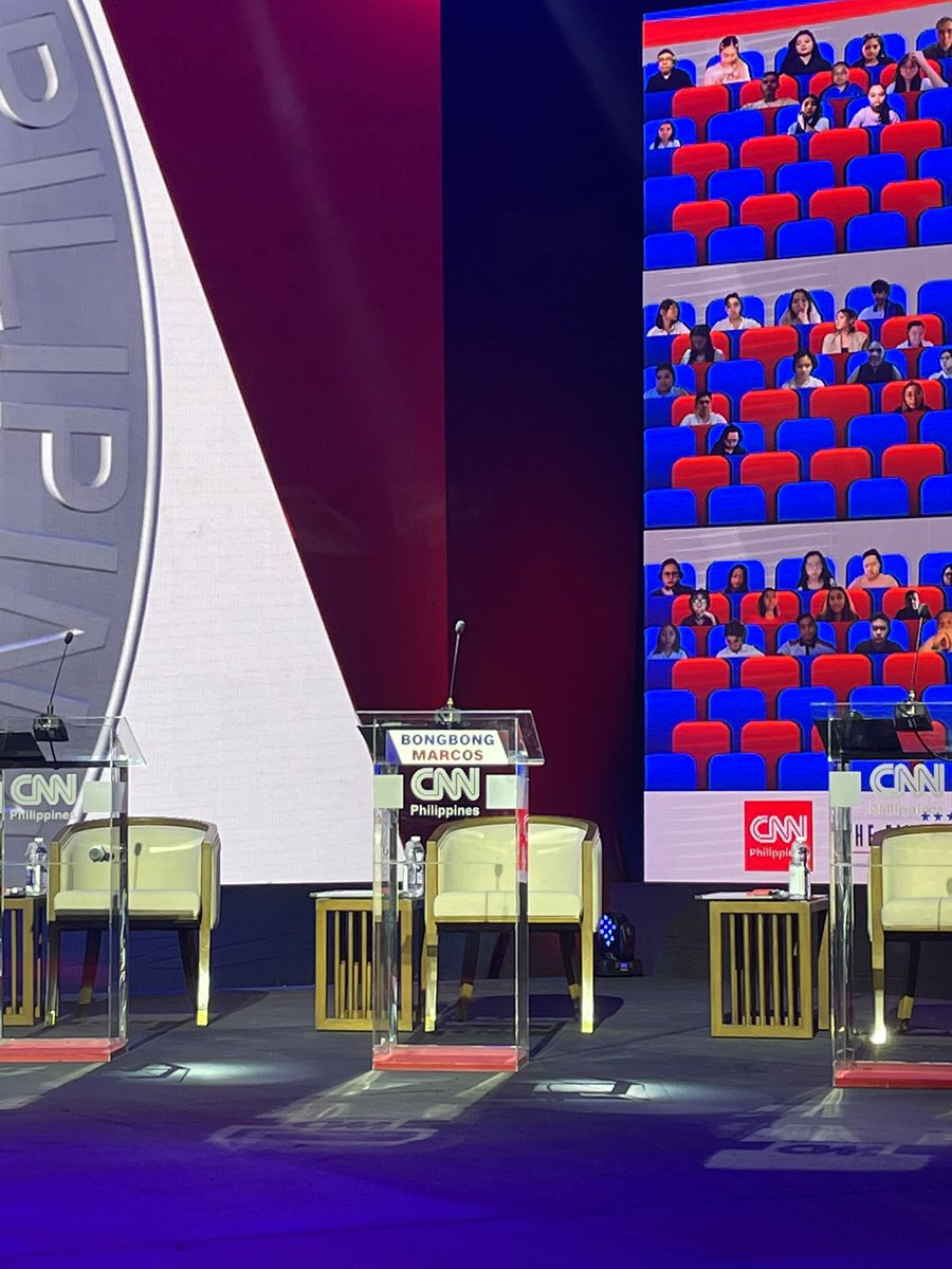 newswatchplusph's tweet photo. An empty podium is put onstage for
presidential candidate Bongbong Marcos.

He would have stood alongside Faisal
Mangondato and Jose Montemayor Jr.,
but he declined our invitation. #CNNPHPresidentialDebate 

🖥️ YouTube: CNN Philippines
💻 Facebook: Sports Desk
📺 Free TV ch. 9 https://t.co/fKzc1tBhYs