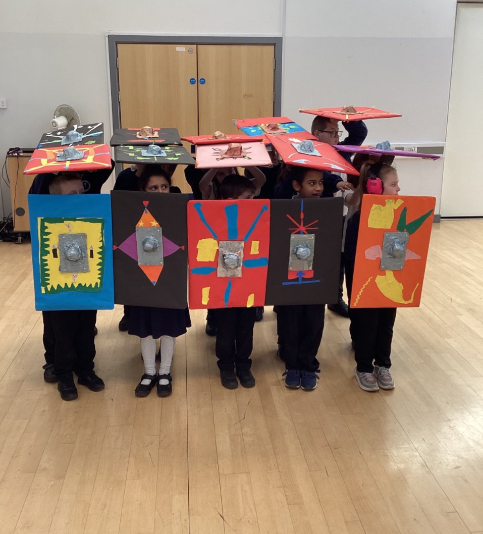 Two of the ways we help children embed their learning - bringing it to life and telling others about it. Here we have Year 4 showcasing their learning about Egyptians to visiting classes, and Year 3 showing off a Roman army formation before a battle with the Celts.