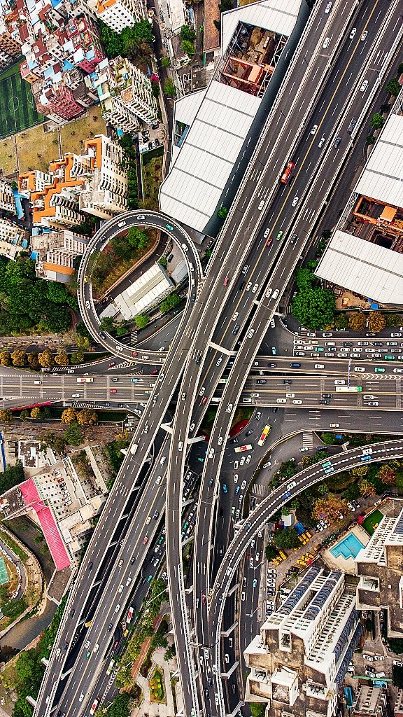 EDNewsChina's tweet photo. Guangzhou Zhongshan No. 1 Interchange is one of the busiest #interchanges in Guangzhou City, south #China’s Guangdong Province. The traffic here extends in all directions, and there are tall buildings all around https://t.co/oBgMcYARpx