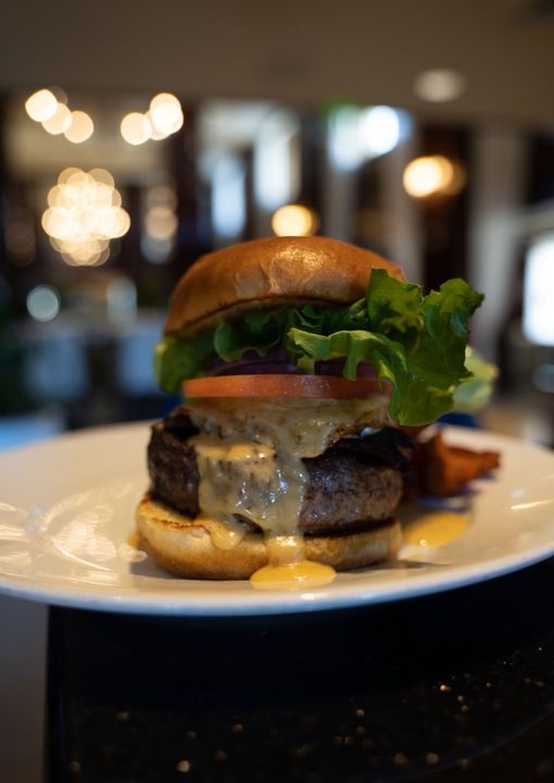 Indulge with a delicious burger 🍔  with a side of oceanview 🌊 

shoresresort.com/dining
 📸 : Natedoesfood @
