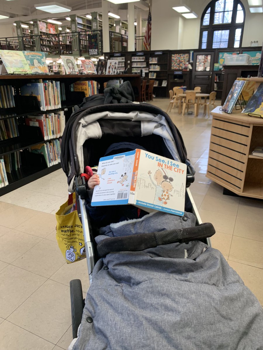 PRHLibrary's tweet photo. I spy a new little #library patron getting lost in a story! Who visited their local library this weekend? #WeekendReading #librarylove https://t.co/iFLcdXklTm