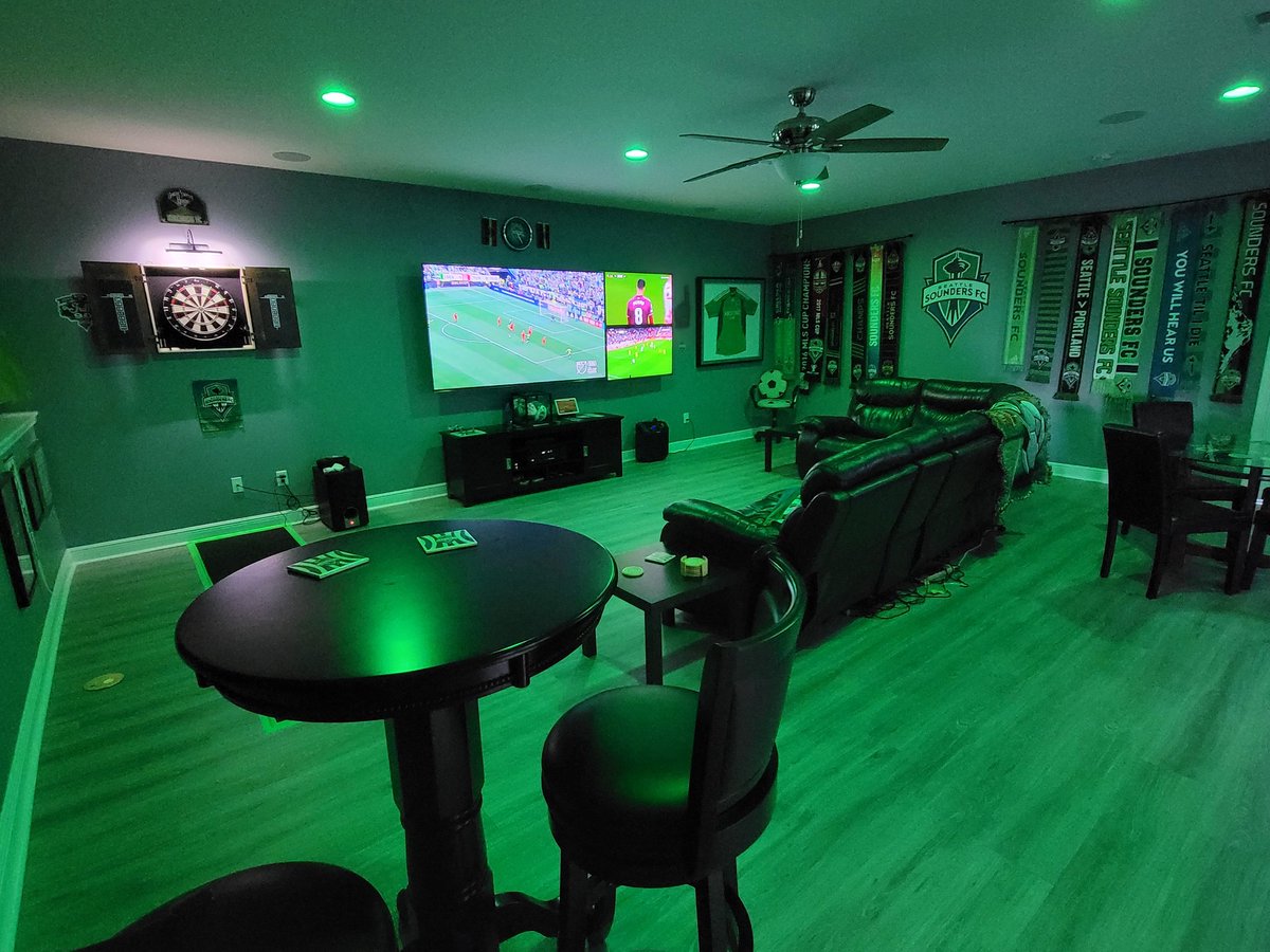 RaveGreenJosh's tweet photo. Ready for the new season!  We couldn't find a good @SoundersFC pub in Central Florida.... So we built our own in our new house. Welcome to Schmetzer's Pub in Winter Garden, FL! Representation from @yedlinny @Stefan24Frei  @TropicSounders @WeAreECS @brianschmetzer &amp; other legends! https://t.co/AsHVszADoJ