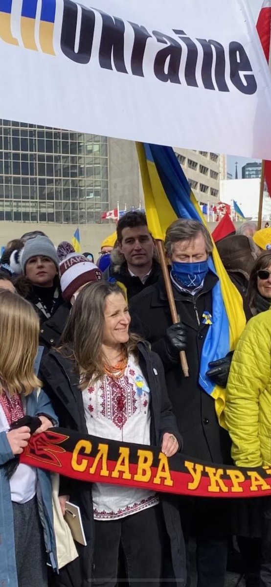 RMLANG's tweet photo. White supremacist nazi protesting. She can’t go fight in the war. She has been banned from these countries. ⁦@cafreeland⁩ https://t.co/790SFbJ1C2