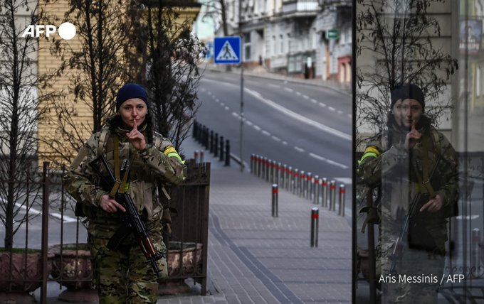 A Ukrainian soldier patrols in Maidan square in Kyiv on February 27