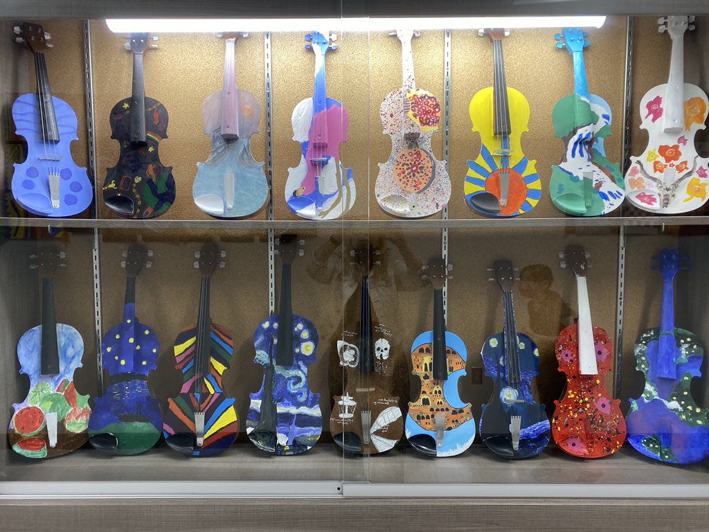 20+ year old damaged practice violins turned into works of art by my 7th grade VA3 students. # verdeArtK8