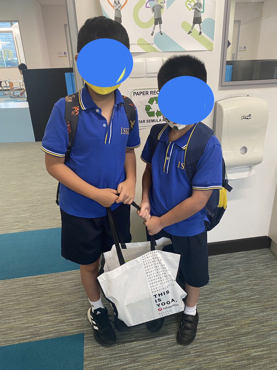 Collecting books for our new multilingual lending library in grade 3. These two had a huge stash they were excited to donate!