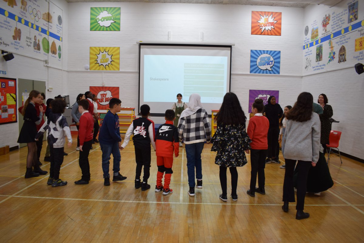 JBprimaryschool's tweet photo. It's great having @bigfootarts in school today providing Introduction to Shakespeare sessions to Y2-Y6.  The children are loving these interactive sessions and getting into Shakespeare characters.  We certainly have some budding actors here at John Burns! @The_Globe 😀👏 https://t.co/lcD4cEYgKB