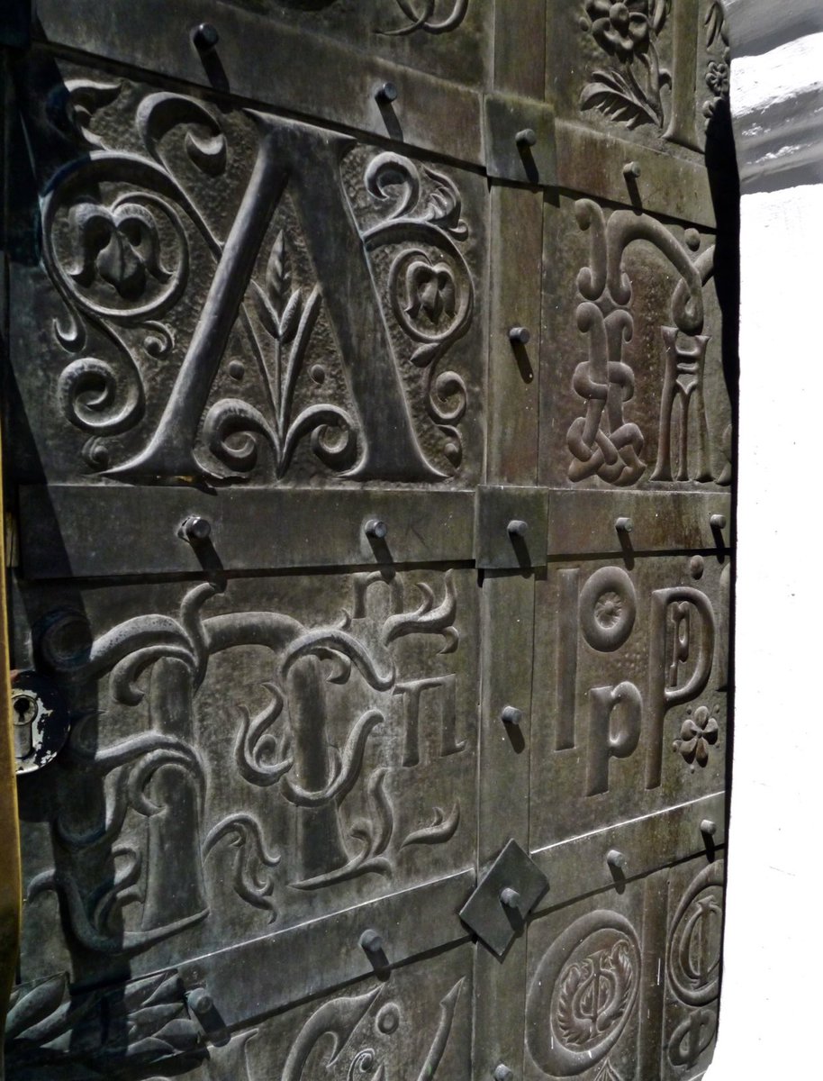 internetstine's tweet photo. thought Book Twitter would appreciate knowing about the Museum of Book &amp; Printing in Kyiv, which I visited in 2015. The door is covered in Glagolitic script (the earliest Slavic alphabet); the collections trace the development of Ukraine’s unique manuscript and print history. https://t.co/UL8cpnSoM0