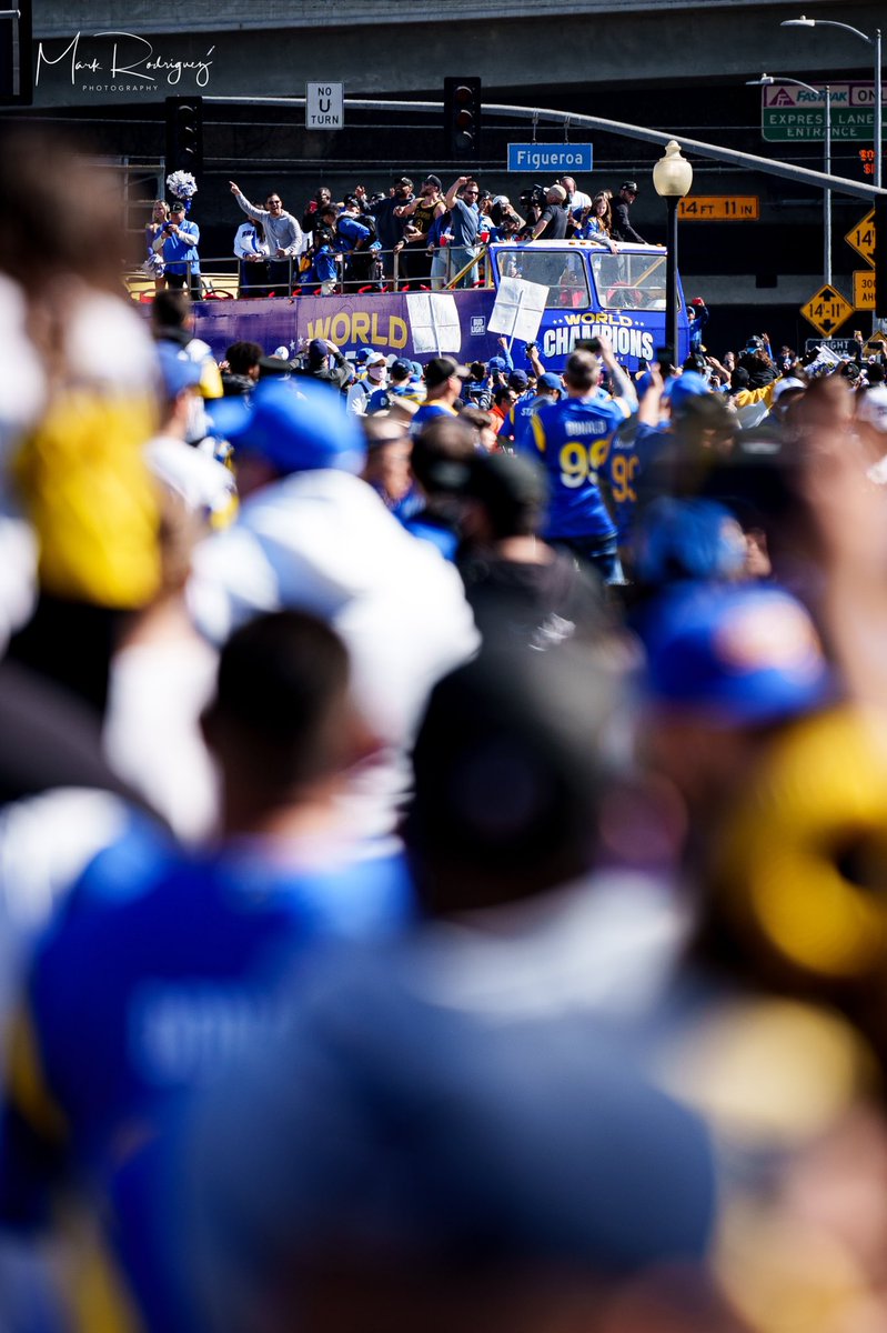 mjrod1985's tweet photo. One of my favorite photos from the LA Rams Super Bowl LVI Victory Parade. First championship parade I’ve been a part of in person. Surreal Moment. What a resilient team! #RamsHouse #SuperBowlLVI #ChampsHouse #CityofChampions #HornsUp #LARams #RunItBack https://t.co/qfFol33ogM
