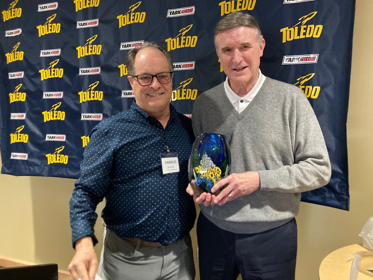 ToledoRockets's tweet photo. Today was the last Downtown Coaches Association luncheon for @UTMikeOBrien as Toledo's athletic director. DCA President Charles Ide presented Mike with this beautiful piece of glasswork on behalf of DCA members. #ForeveraRocket https://t.co/K811ddCP5K