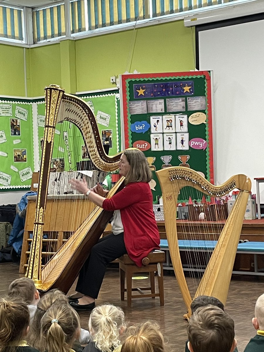 AYFprimary's tweet photo. Foundation Phase had the privilege of listening to traditional Welsh songs being played on a harp this afternoon. We sang and danced along to the music. Dydd Gŵyl Dewi Sant.  @CSC_FP @CSC_ExpArts @CymraegCampus https://t.co/SIgKrELCJY