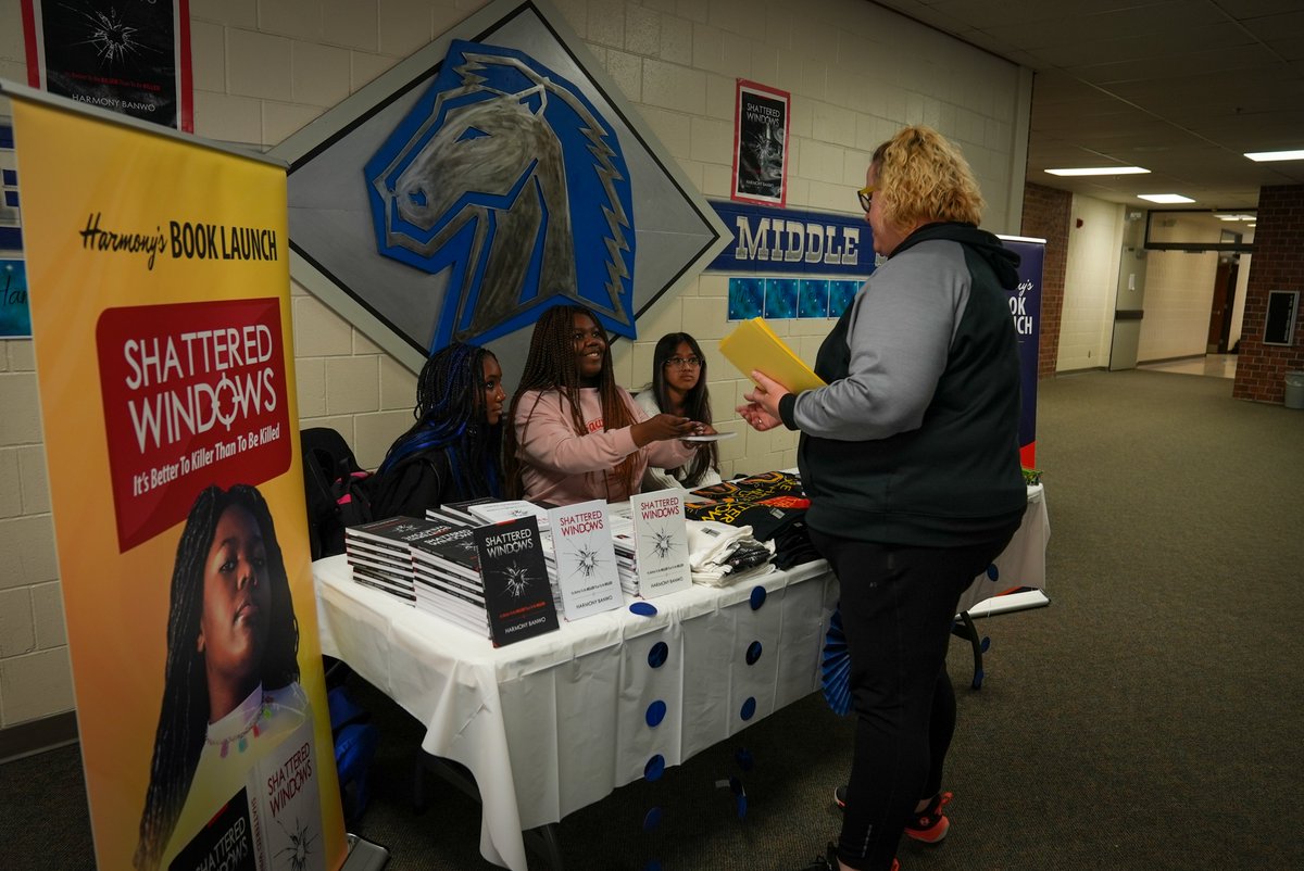MillardPS's tweet photo. At just 13 years old, Harmony Banwo is a published author. The @NMS_Mustangs student celebrated the launch of her book by hosting a book signing for her classmates. "Shattered Windows" is currently available on Amazon. #Proud2bMPS https://t.co/djFhoQLgvs