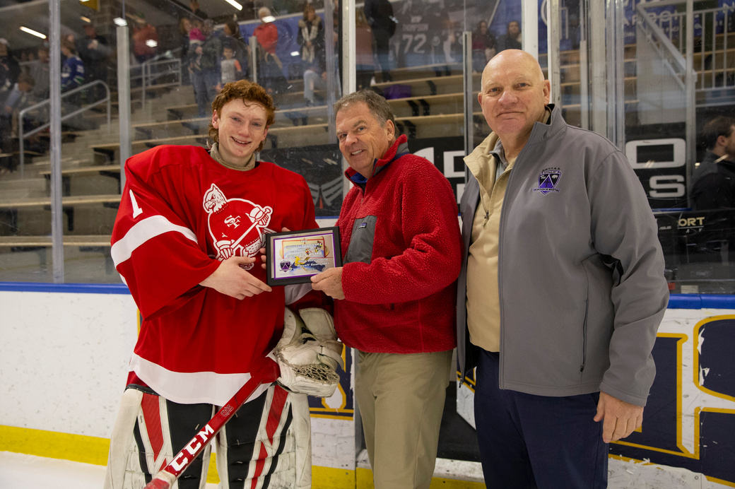Buffalo News Photographer James P. McCoy and <a href="/MonsignorMartin/">Pete Schneider</a> Pete Schneider present <a href="/SFHS_Athletics/">SFHS Athletics</a> goaltender Jack Zuchlewski with the first annual <a href="/miggyrod33/">Miguel Rodriguez</a> outstanding goaltender award. Rodriguez passed away from COVID complications in January.