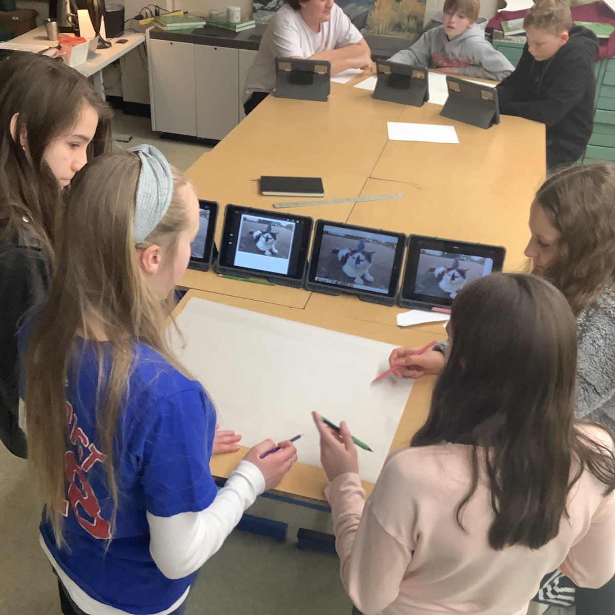 7th grade students are working on groups to break down this car into simple shapes. Then as a team, they will draw the shapes in proportion. #drawinglessons #juniorhighart #middleschoolartlessons #gradualrelease