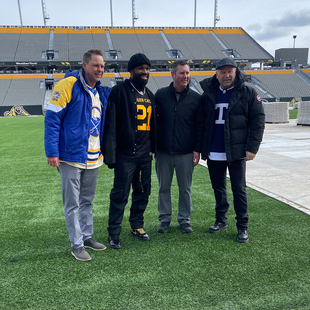 Ticats's tweet photo. We're just a few weeks out from hosting the Heritage Classic. So, it's only right to have @Simoni_Lawrence show a couple of hockey's finest (@martybiron43 &amp; @wendelclark17) around Tim Hortons Field!

#Ticats | #NHL https://t.co/EtO2bbubME