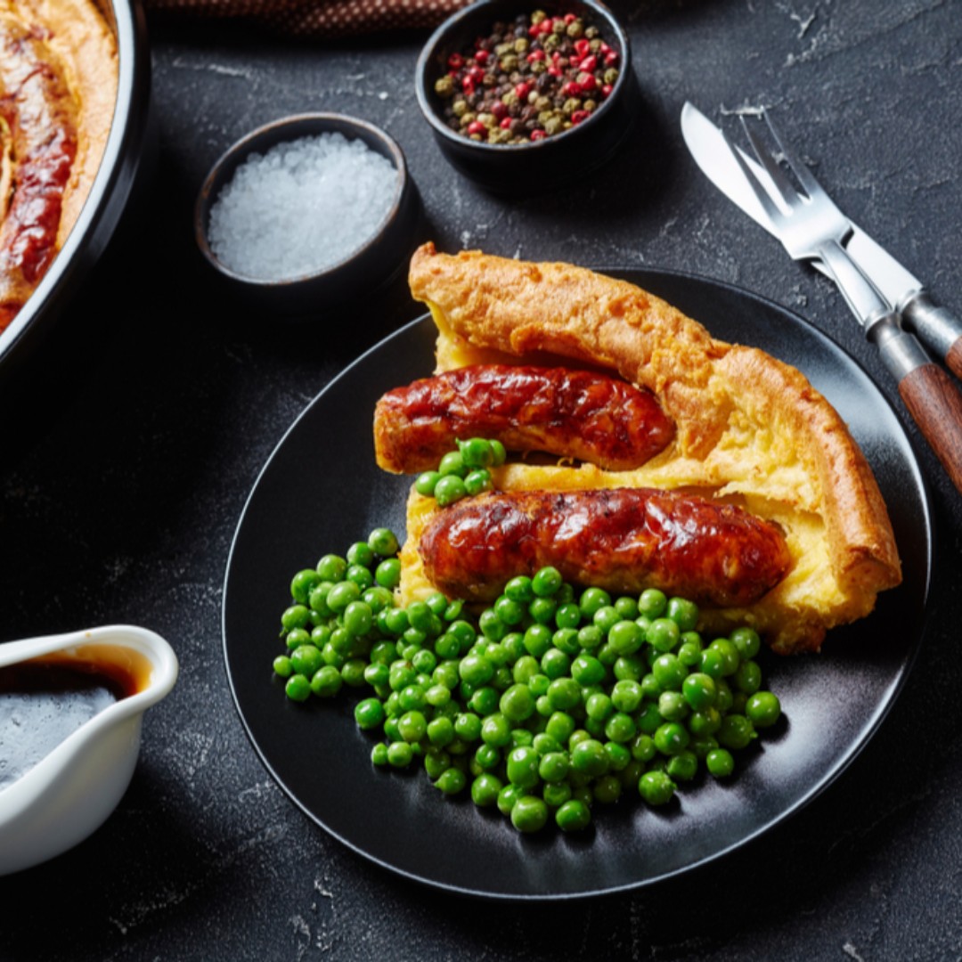 Toad in the Hole, peas and gravy. Make extra pancake batter today, then you'll be able to whip this up for supper tomorrow. 

Oh, and if you order your sausages by 5pm today as well, they'll be delivered to you in time as well. A hole in one you could say...