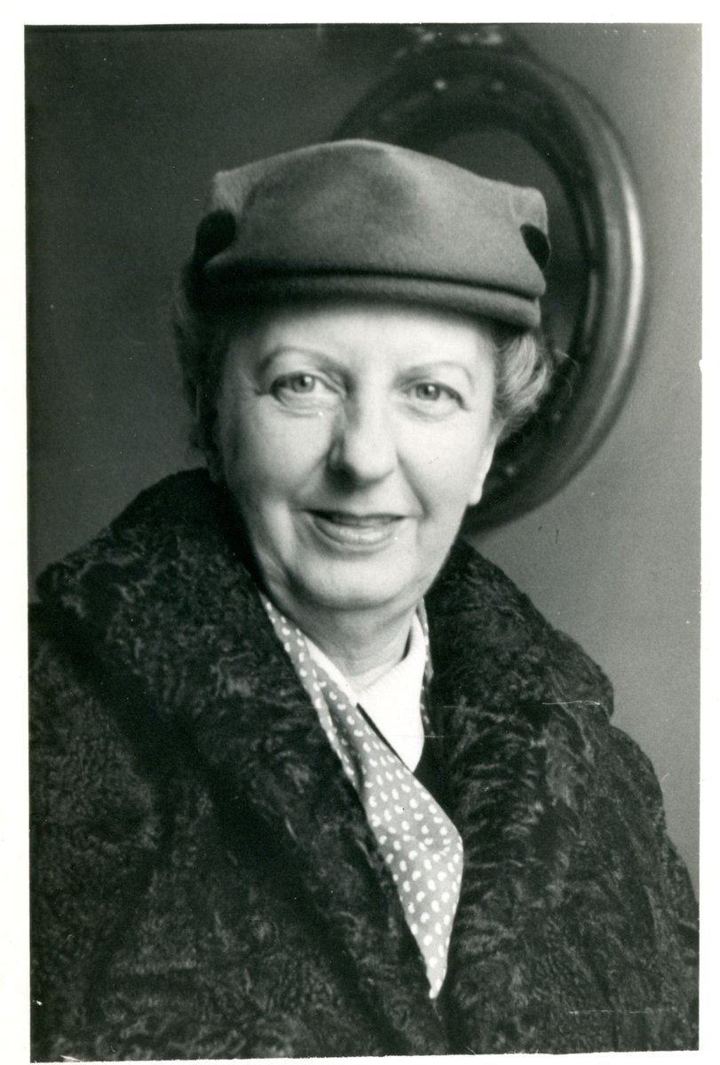A black and white photograph of Joan Cross