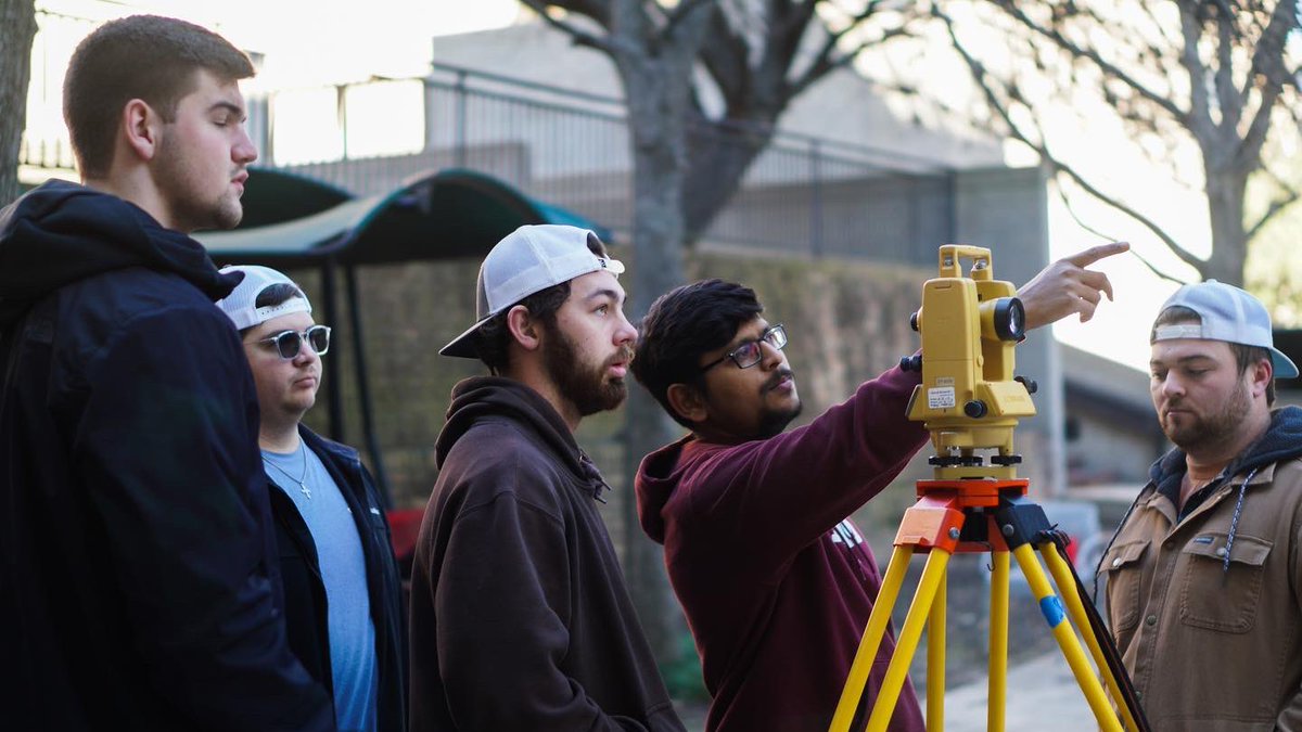 TAMUArchCollege's tweet photo. Construction science students using field calculation equipment work on a surveying assignment in the breezeway between Langford A, B and C.
@TAMUCOSC @TAMU #constructionscience #surveying #tamucosc #hardhats https://t.co/sDgORLCHNb
