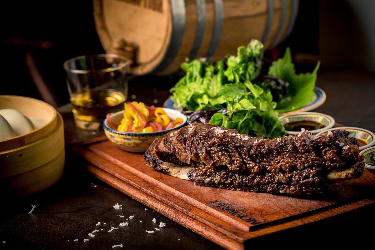 The BFR – aka Big F*@$king Rib - is an absolute classic; an overnight braised short rib with steamed buns, sesame leaves, and lettuce leaves, served with steamed Taiwanese bao buns, pickles, lettuces, herbs and three sauces (Chimichurri, Hoisin, Red Dragon). 🔥 #DrunkenDragon