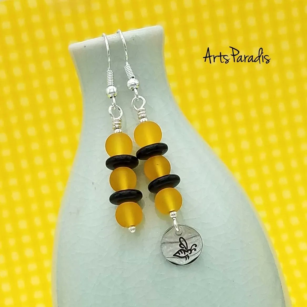 Sometimes I only have one of some charms. So I came up with this fun asymmetrical design. I think I'm sharing this design again because I want spring to get here so bad! ArtsParadis.com #handmadejewelry #womanowned #LGBTQowned #proudartist #beecharmer #beejewelry