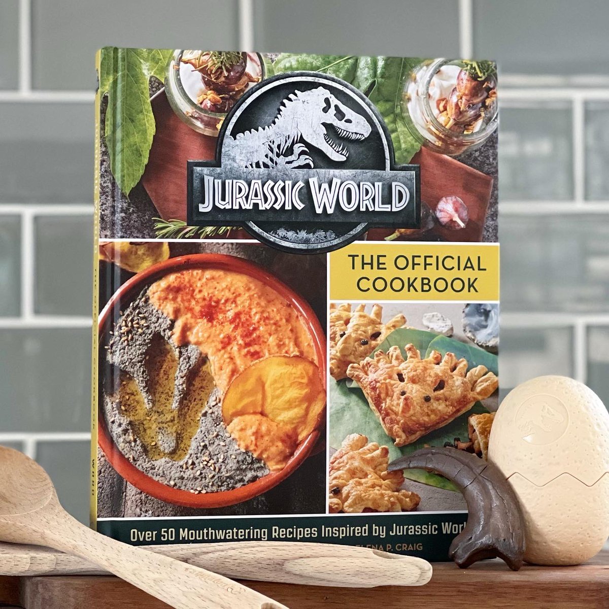 collectjurassic's tweet photo. COOKING WITH JURASSIC! The first official Jurassic World Cookbook is coming soon — filled to the brim with unique and yummy dino park-themed culinary delights. Preorder now on Amazon at the link below:

https://t.co/ZYwoDwA7Dh

#collectjurassic #jurassicworld #officialcookbook https://t.co/wa4lTFfrAG