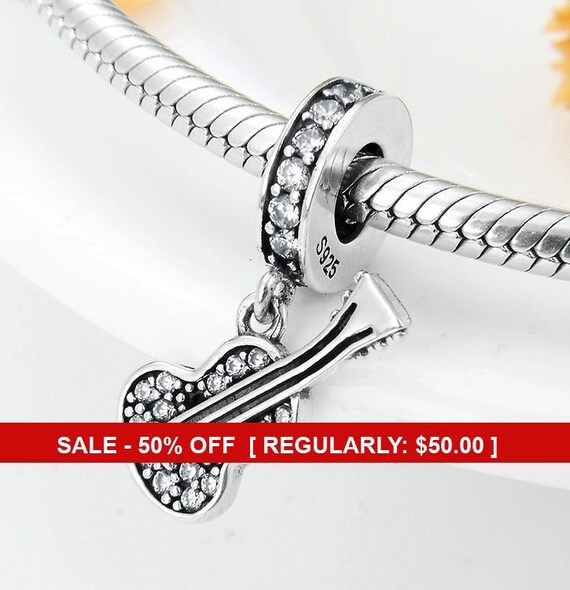 Jennife57232043's tweet image. Sterling Silver Guitar Charm, Music Charm, Guitar etsy.me/3vpRwZs #sterlingsilver #pandoracharm #guitarcharm #musiccharm @etsymktgtool