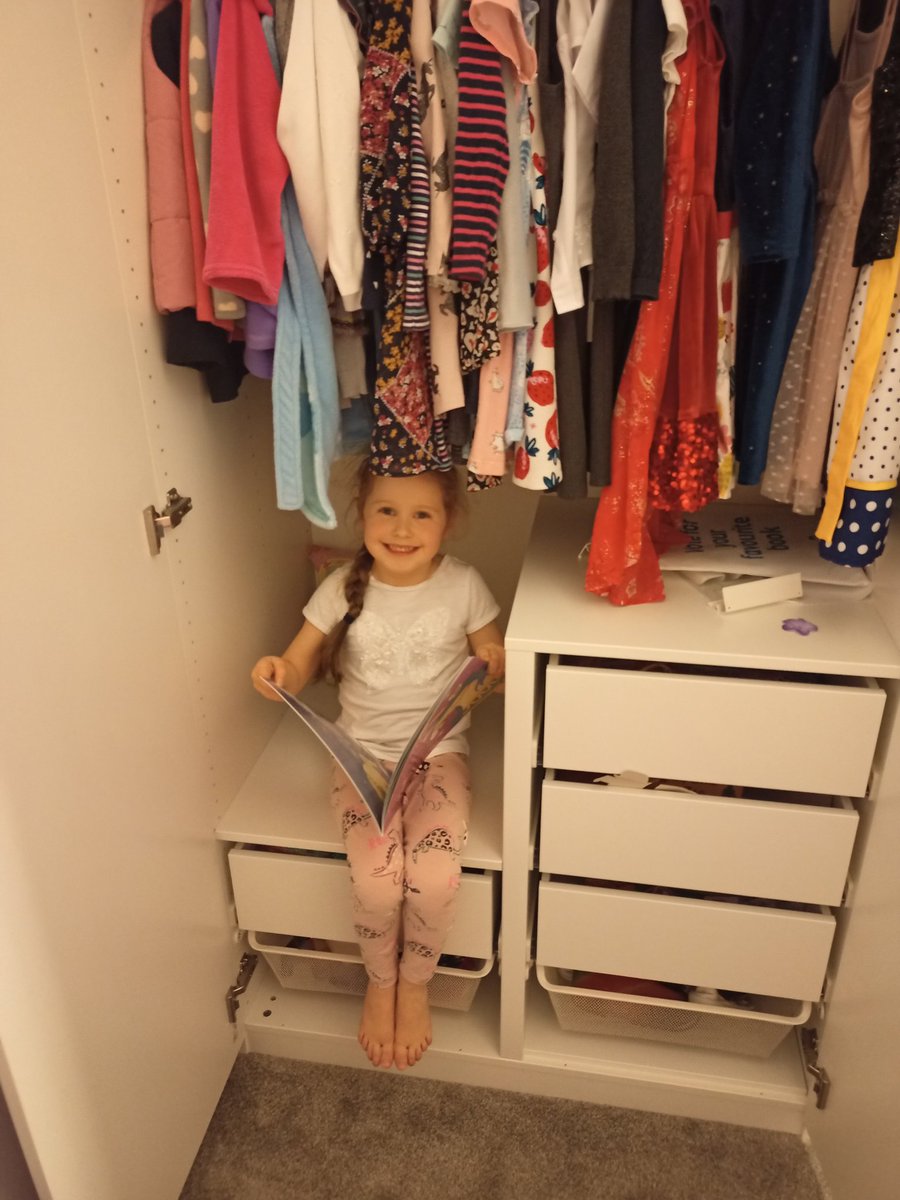 Evie enjoying reading her book inside her wardrobe 📖 <a href="/StDavids4/">St David's PS & NC</a> #WorldBookDay