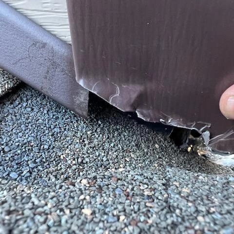 This is how <a href="/256roofing/">Thompson Roofing</a>  fixes a roof they built incorrectly. This is where the chimney meets the roof. They even admitted that they did it wrong initially. Don't ever use them.