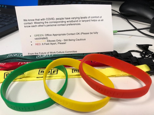 As <a href="/NPR/">NPR</a> reopens its Washington building, it's taking a creative approach to differing degrees of COVID comfort.

Employees get wristbands &amp; lanyards in 3 colors. You pick which one to wear:

green = "office-appropriate" contact ok
yellow = elbow bumps only
red = stay 6 feet away!