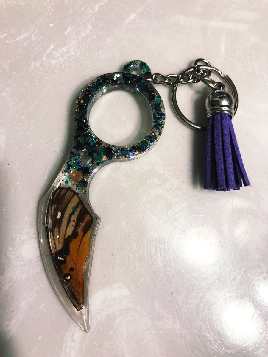 Hand made by me, Self Defense Keychain with faux leather tassel, real monarch butterfly wing, genuine citrine, and glitter. Please check your state laws regarding self defense weapons before bidding, or just don't get caught. ;) 
Bid starts @ 200 $DOGE
