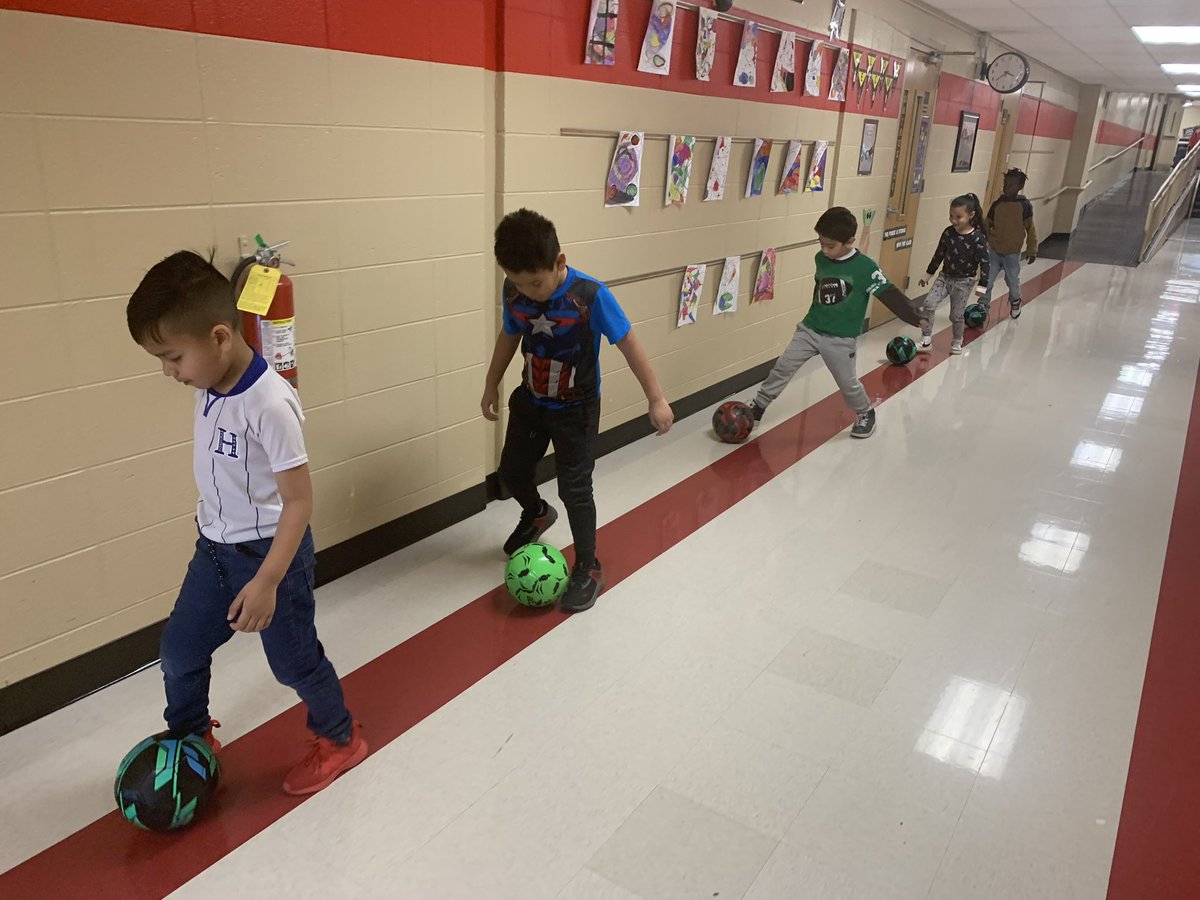 Stuartbulldogs's tweet image. Every 4 weeks, we have electives classes at Stuart. These little ones chose “soccer” for their class this semester. Mrs. Baird is having them practice dribbling down the hall, stopping, and staying on the red line. #buildingrelationships❤️ #exploringnewthings @IHeartCKH