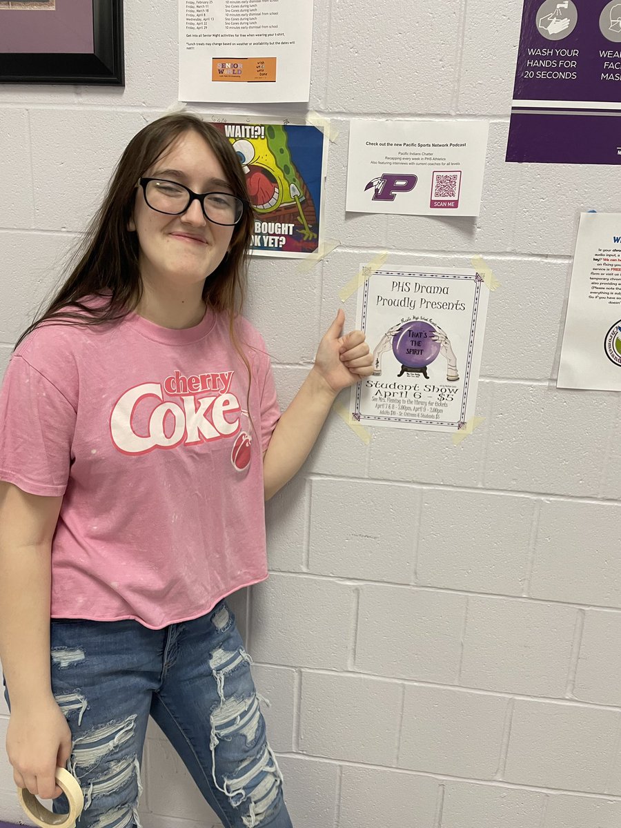 PHS_Warrior's tweet photo. Sophomore Gracie Mouio hangs posters to advertise for the school play, “That’s the Spirit,” before the student show on April 6th. Buy tickets for $5! 
Photo by Zoe Johnson https://t.co/b2O23HoNlm