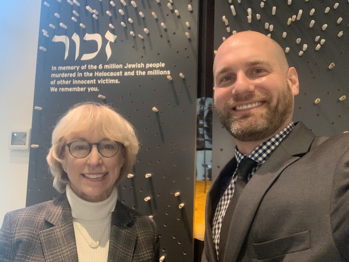 Dozler stands next to Dee Simon, Seattle Holocaust Center for Humanity.