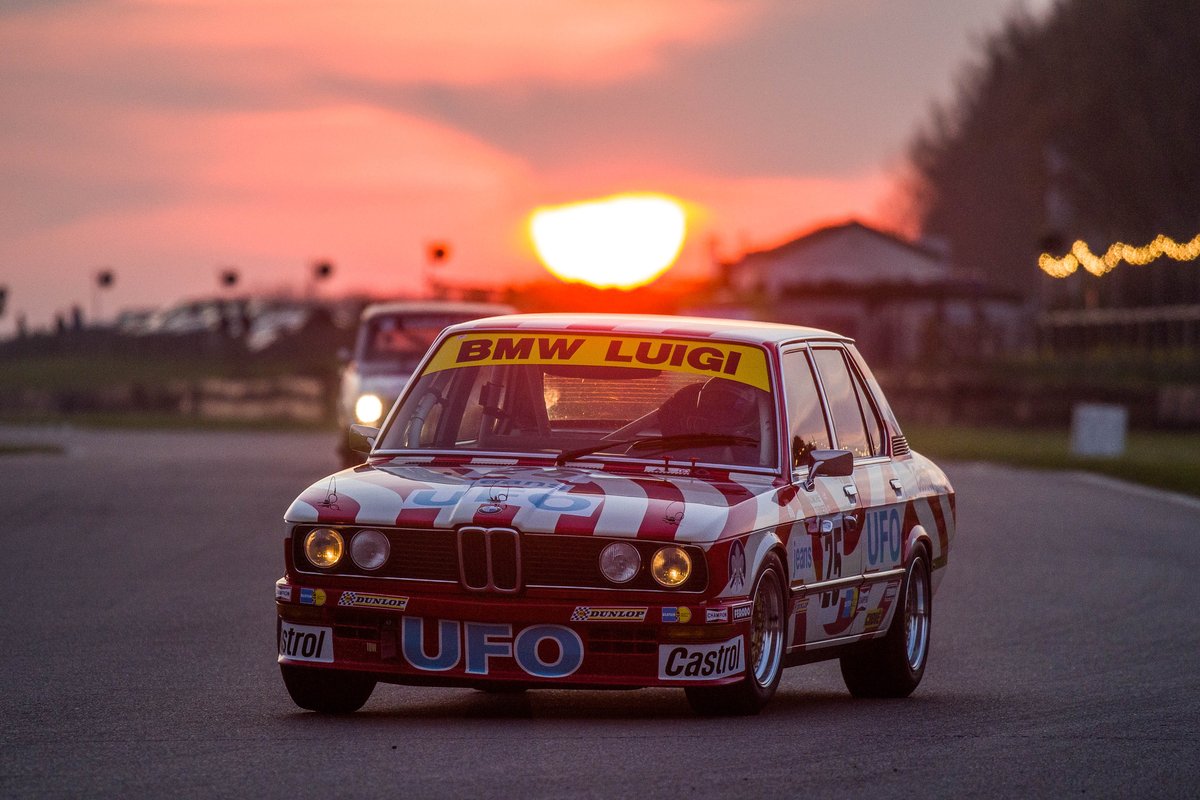 GoodwoodRRC's tweet photo. The BMW 530i in BMW Luigi colours looks fabulous with the Goodwood sunset #77MM https://t.co/0FNo7cDkyl