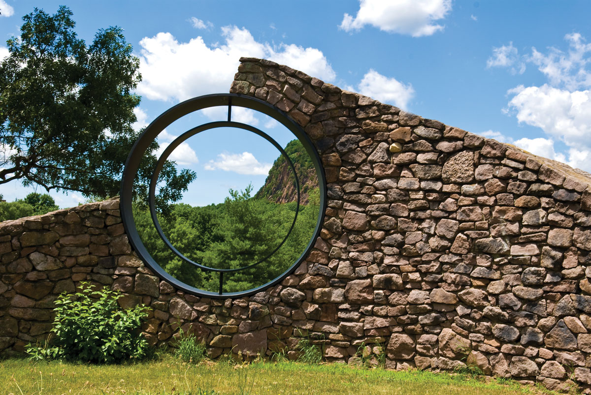 “End of the Line” | SCSU Campus | 1985
Nancy Holt (1938-2014) nancyholt.com
In this work, two rings frame views of West Rock, showcasing the geological formation as an art object. 
#PublicArtCT #WomensArt #SCSU #LandArt
