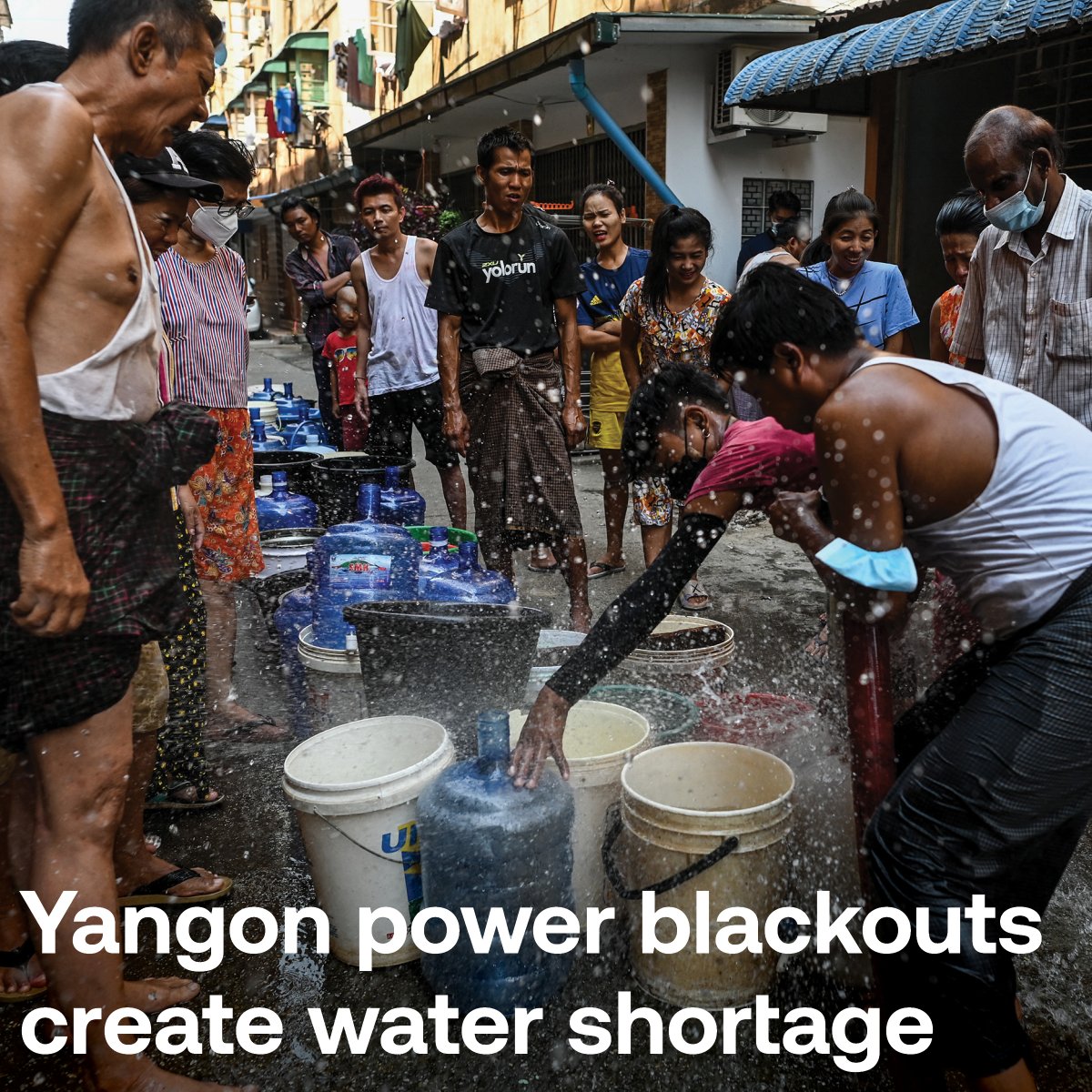 RadioFreeAsia's tweet photo. Rolling power outages have left many residents in Myanmar’s largest city of Yangon lining up for water — carrying large blue containers and plastic buckets as the country continues to plunge into economic disaster more than a year after the military seized power. 

Photos: @AFP https://t.co/Q1IBptvpgT