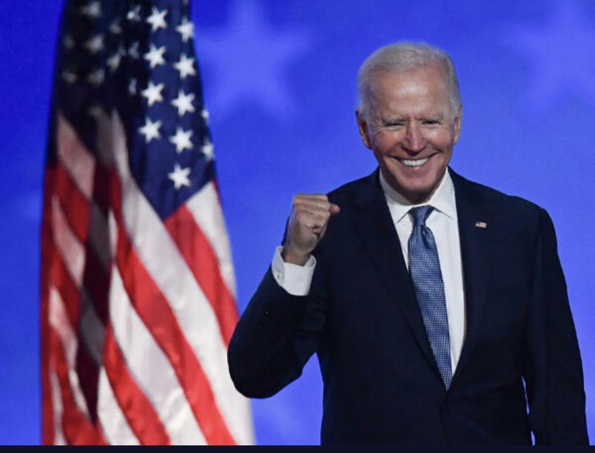 billsankey's tweet photo. @JoeBiden I’m guessing this is photoshopped because this guy would never stand in front of our flag. https://t.co/DGB57vrmTC