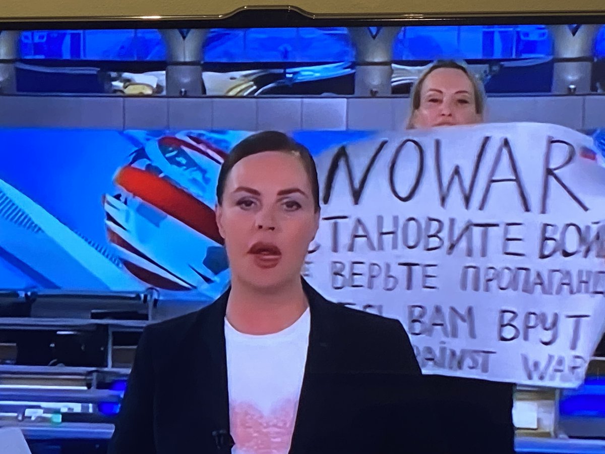 QuentinDempster's tweet photo. Russians against war in Ukraine, Courageous state-run Channel One TV producer Marina Ovsyannikova has been arrested after live to air demonstration with placard: “No war. They lie to you here”. She faces five years in jail. https://t.co/UliHNgdgkG