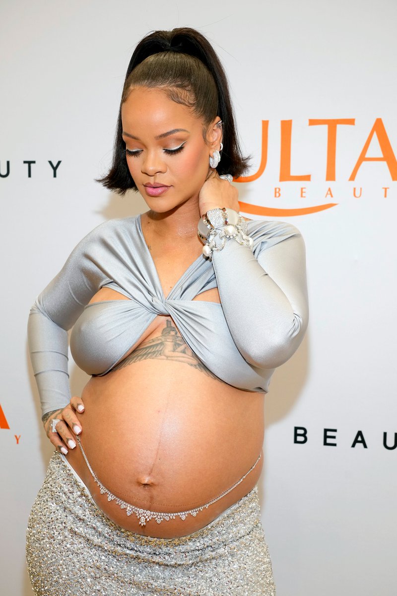 POPSUGARUK's tweet photo. Rihanna's outfit consisted of a silver long-sleeved, crisscross halter top and matching embroidered column skirt by Coperni. https://t.co/vYfUkyKqDJ https://t.co/hJ68h5atwN