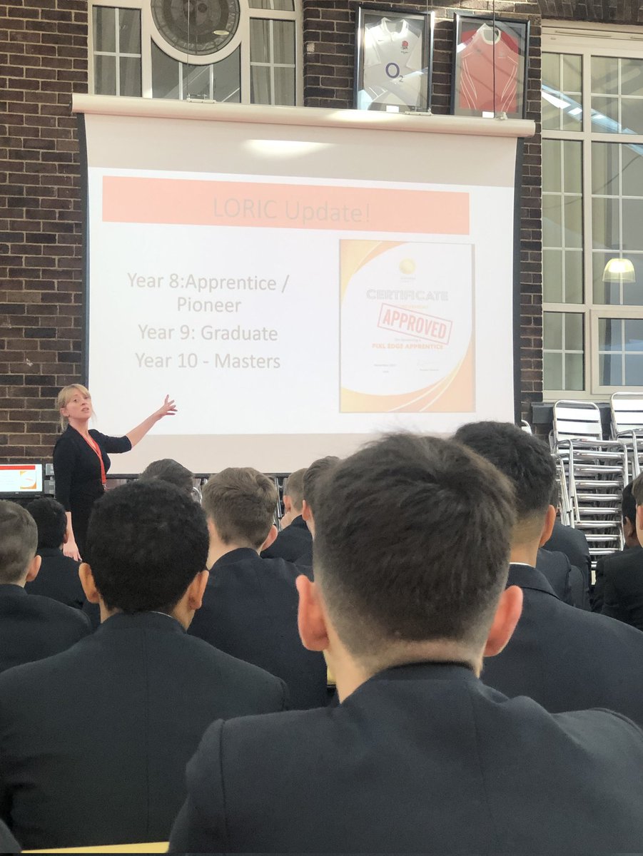 AudenshawSchool's tweet photo. Mrs Jones again speaking to year 9 today about their #LORIC progress and celebrating our first ever students to achieve the #pixledge Graduate award. Well done boys, Masters next!π¬ @PiXLEdge https://t.co/RV9zkXRng7