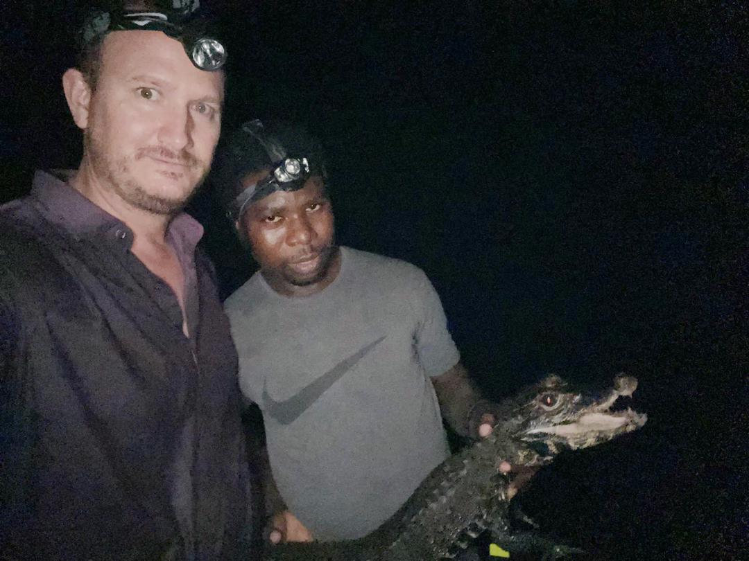 WCS_Nigeria's tweet photo. Peter Abanyam, recipient of the WCS John Thorbjarnason Fellowship, searching for slender snouted crocodiles with Matt Shirley in Cross River National Park. https://t.co/LUNLNVokTq