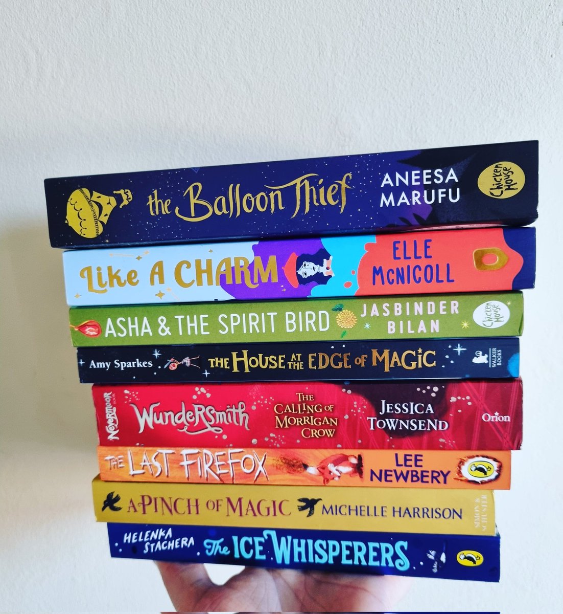 ReadsRina's tweet photo. Showing off some of the beautiful Middle Grades on my tbr! Currently reading #Wundersmith with @BookmadB and it's just as magical as Nevermoor. What was the last middle grade book you read? #books #ChildrensBooks #middlegrade #BookTwitter #Bookstack https://t.co/V8hHUKVOLh