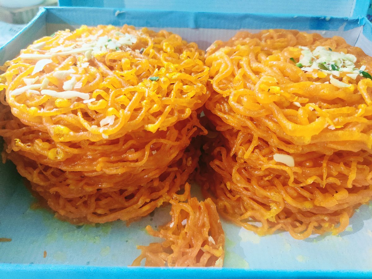 meghu's tweet photo. The Sindhi Gheeyar, a must have Holi speciality. Ordered from the one & only #ChainaRam Chandni Chowk. My childhood memories are entwined btwn the spirals of these sweet disks 🙂
Missing chachu as he always made it a point to get a box for me..for us.
#Holi2022 without my men. https://t.co/nWMX3IWNLE