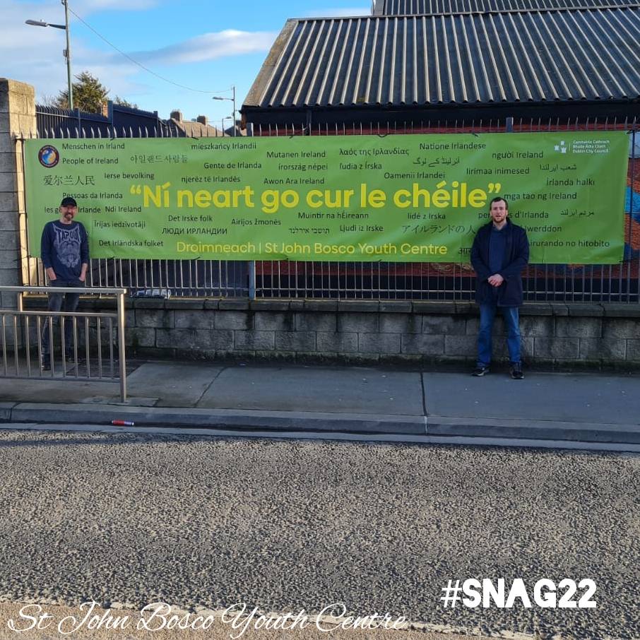 Displaying our banner outside the centre as part of 
Seachtain na Gaeilge (Irish Language Week).
 
Created by local young people, our banner proudly celebrates the diversity of our community. 

#snag22 #stjohnboscoyouthcentre #drimnagh #Ireland