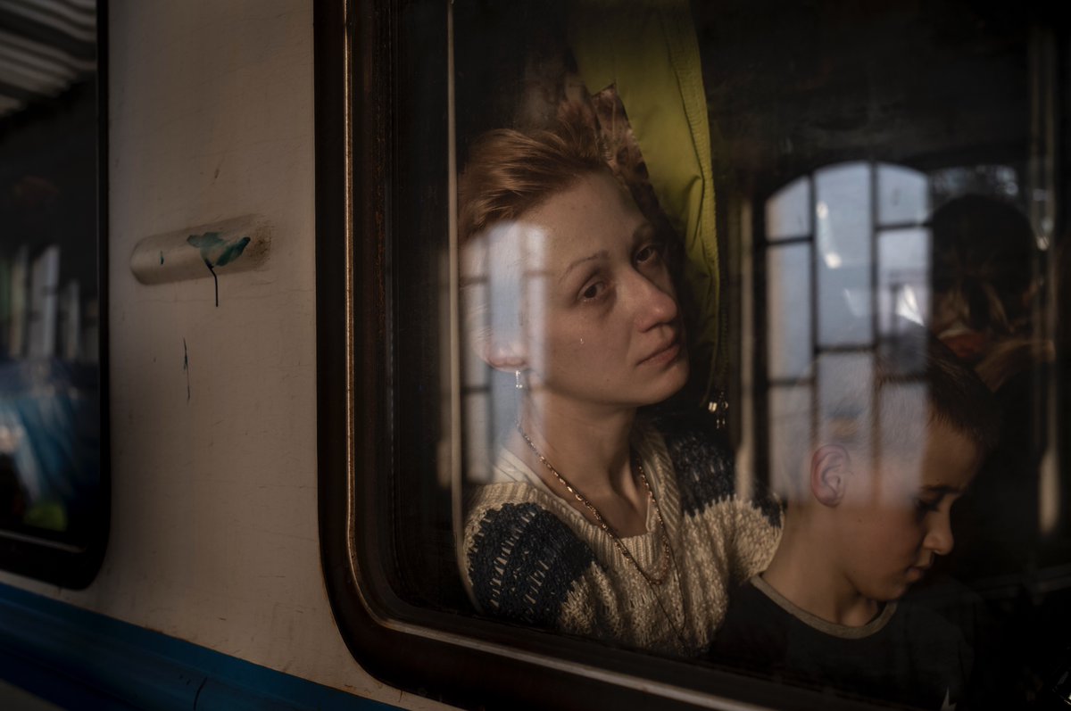 A woman and her son in #Lviv #Ukraine on their way to #Poland and an uncertain future.  Two of the millions of #refugees fleeing the #ukrainewar <a href="/reduxpictures/">Redux Pictures</a>