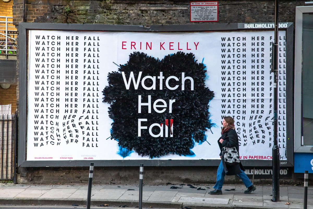 buildhollywood's tweet photo. From best-selling author @erinjelly, #WatchHerFall is a game-changing thriller that twists, turns, and enthralls and shocks readers. To celebrate its paperback launch, we worked with @HodderBooks to translate the story onto the street, with a feather-filled creative billboard. https://t.co/YohZsoOsAd